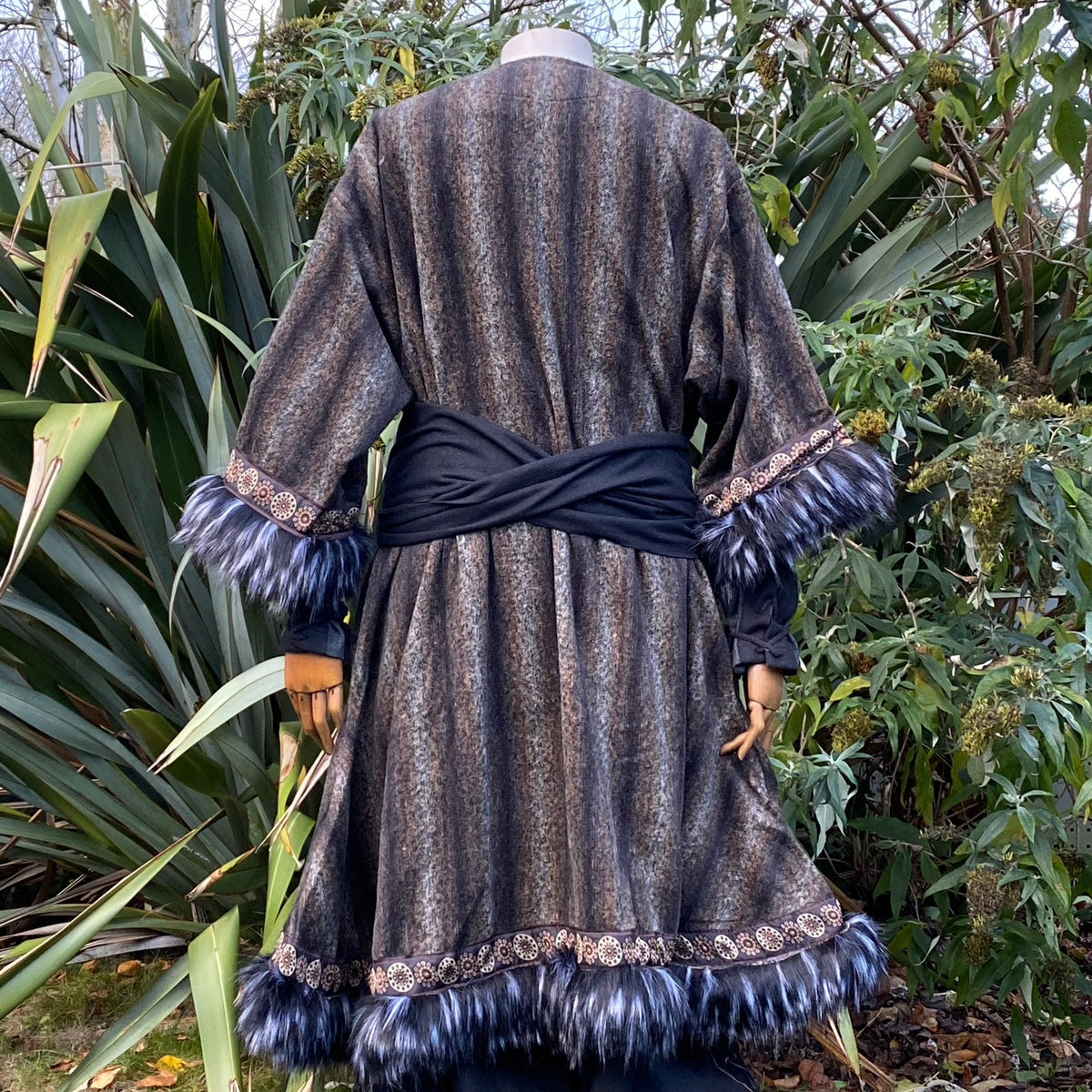 Medieval LARP outfit back view, featuring a grey and black fur trim tunic and matching hood.