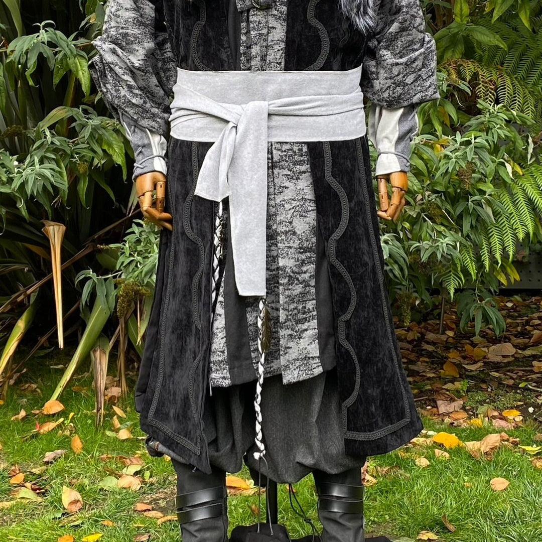 Medieval LARP outfit with grey sash and black accessories.