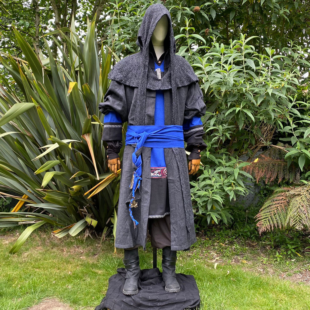 LARP costume with blue sash, black hooded cloak.