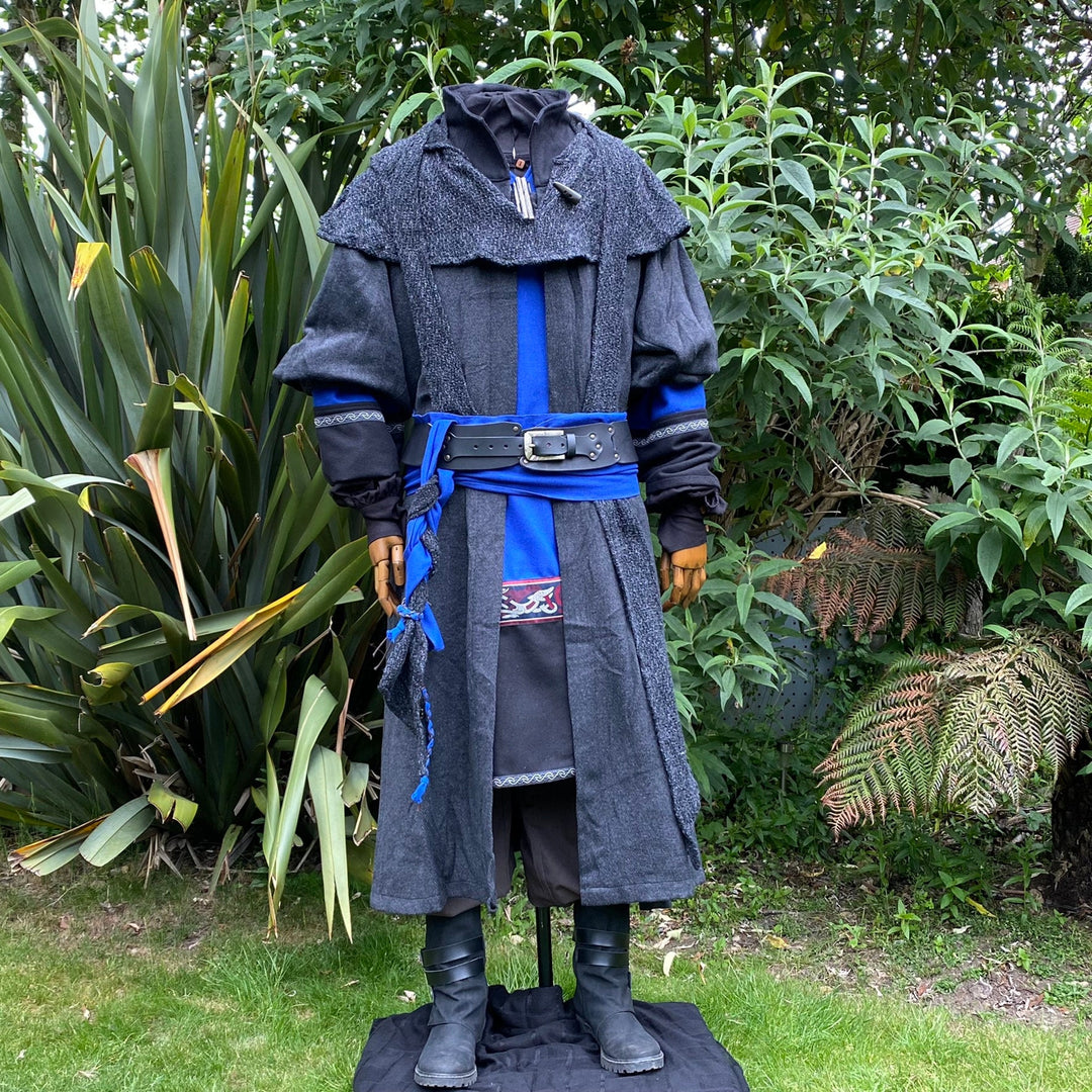 Medieval LARP attire with blue-black belt, garden background, front view.