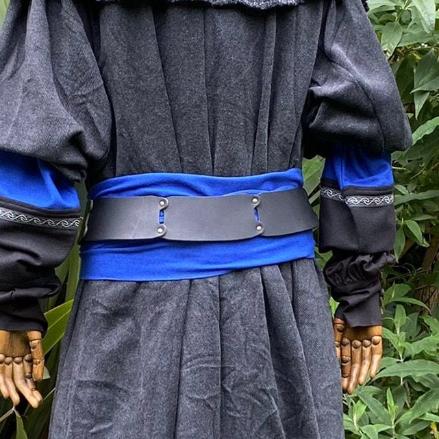 Back view of blue sash and black belt on a medieval LARP costume.