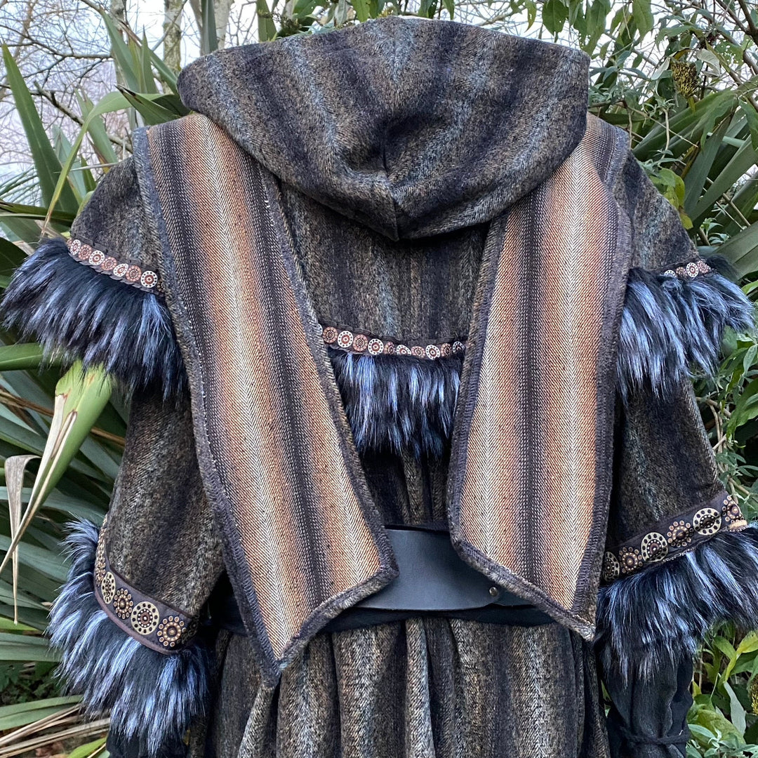 Back view of medieval LARP hood, striped with dark fur accents and embroidery.