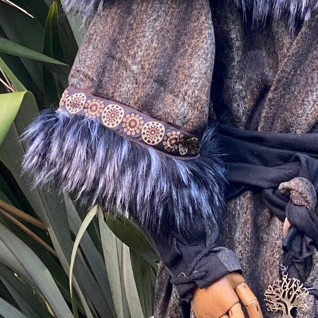 Grey and black mohair tunic with sash, fur trim, and medieval design.