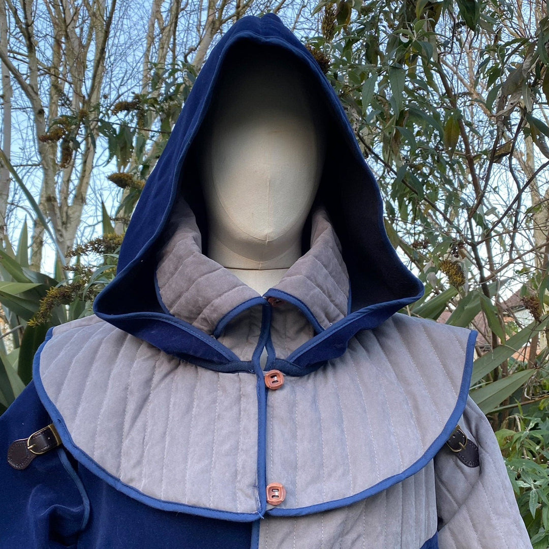Mannequin wearing blue-grey snood hood with quilted mantle, medieval style.