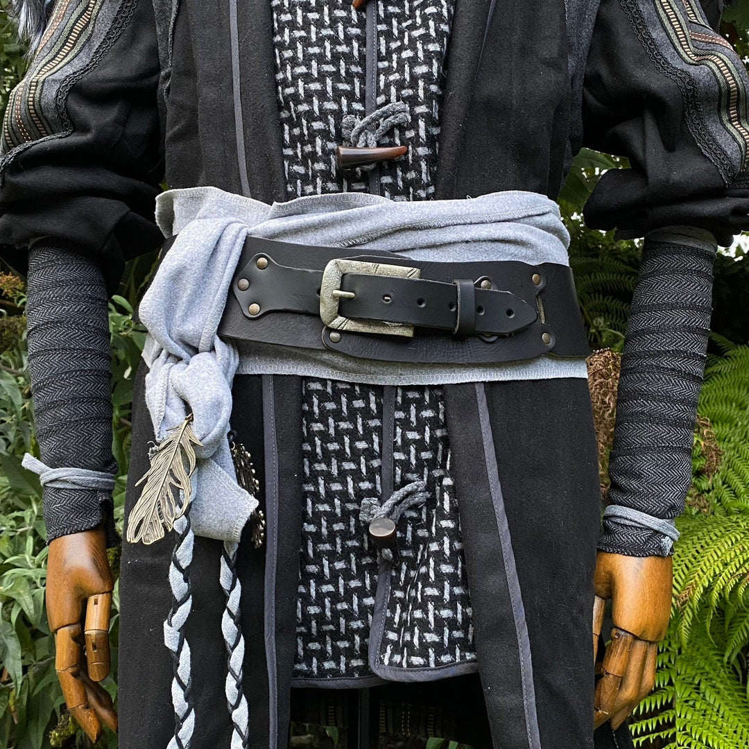 LARP costume with grey herringbone arm wraps and leather belt detail.