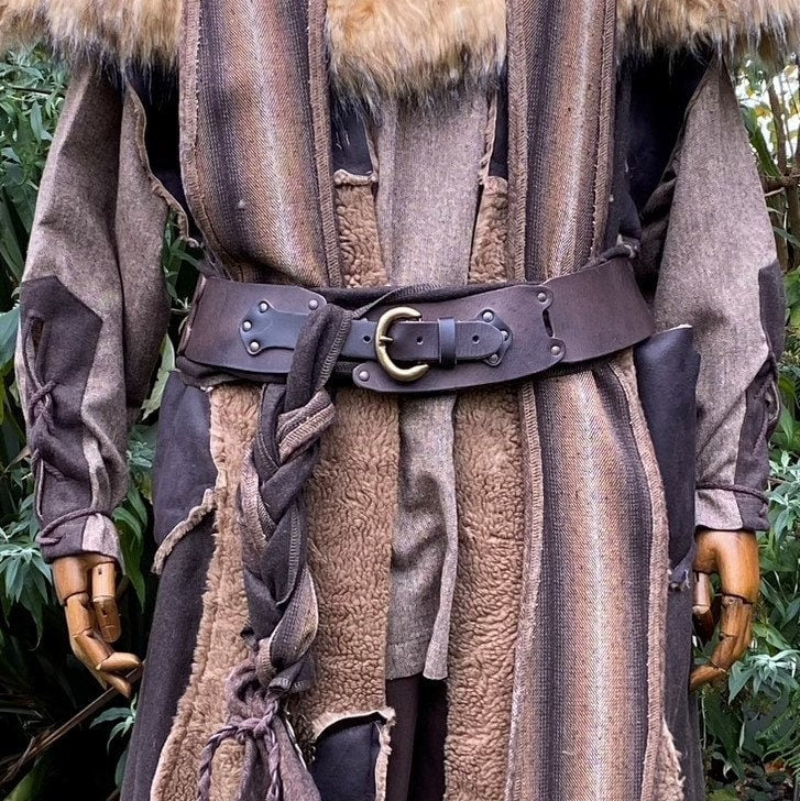Brown leather LARP belt on medieval costume with fur accents, front view.