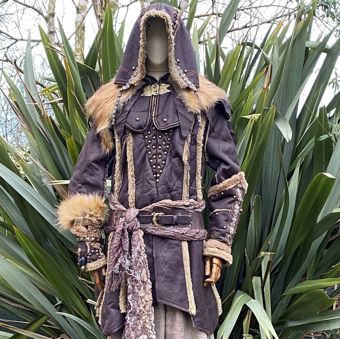Hooded medieval LARP outfit with fur trim and rivet details.