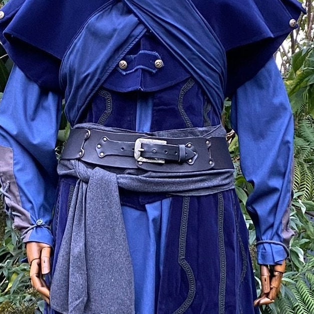 Blue medieval LARP attire with black belt and grey sash detail.