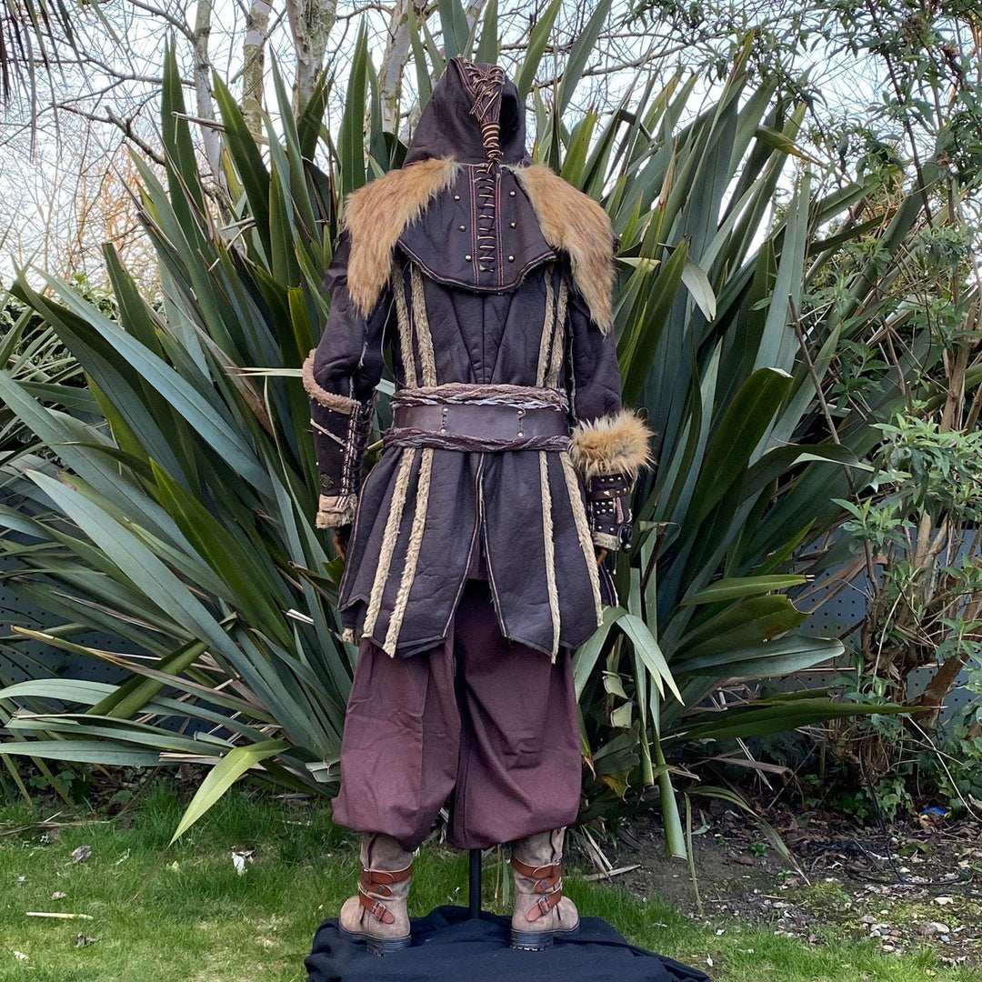 Back view of a medieval LARP outfit highlighting fur-trimmed sleeves.