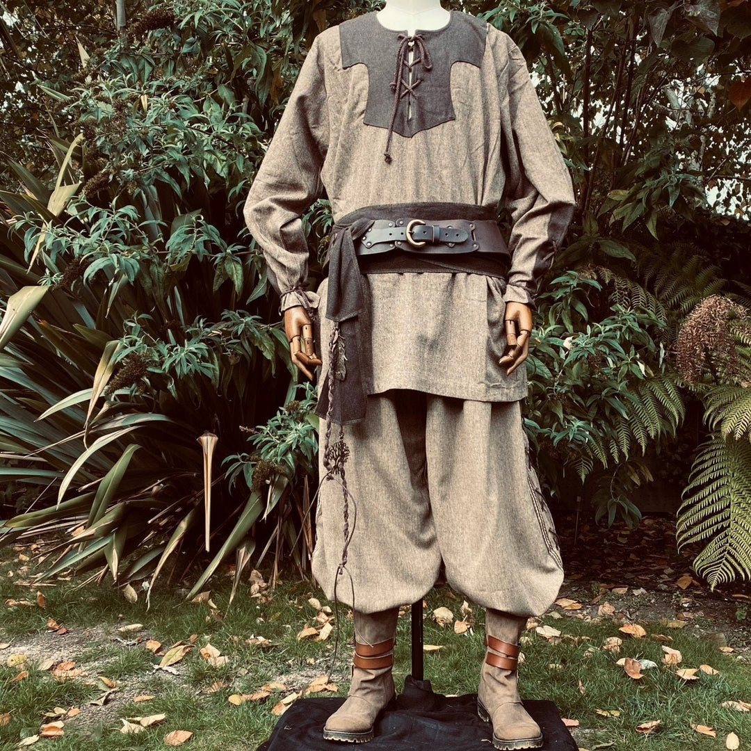 Two-tone medieval LARP outfit with sash and sturdy boots.