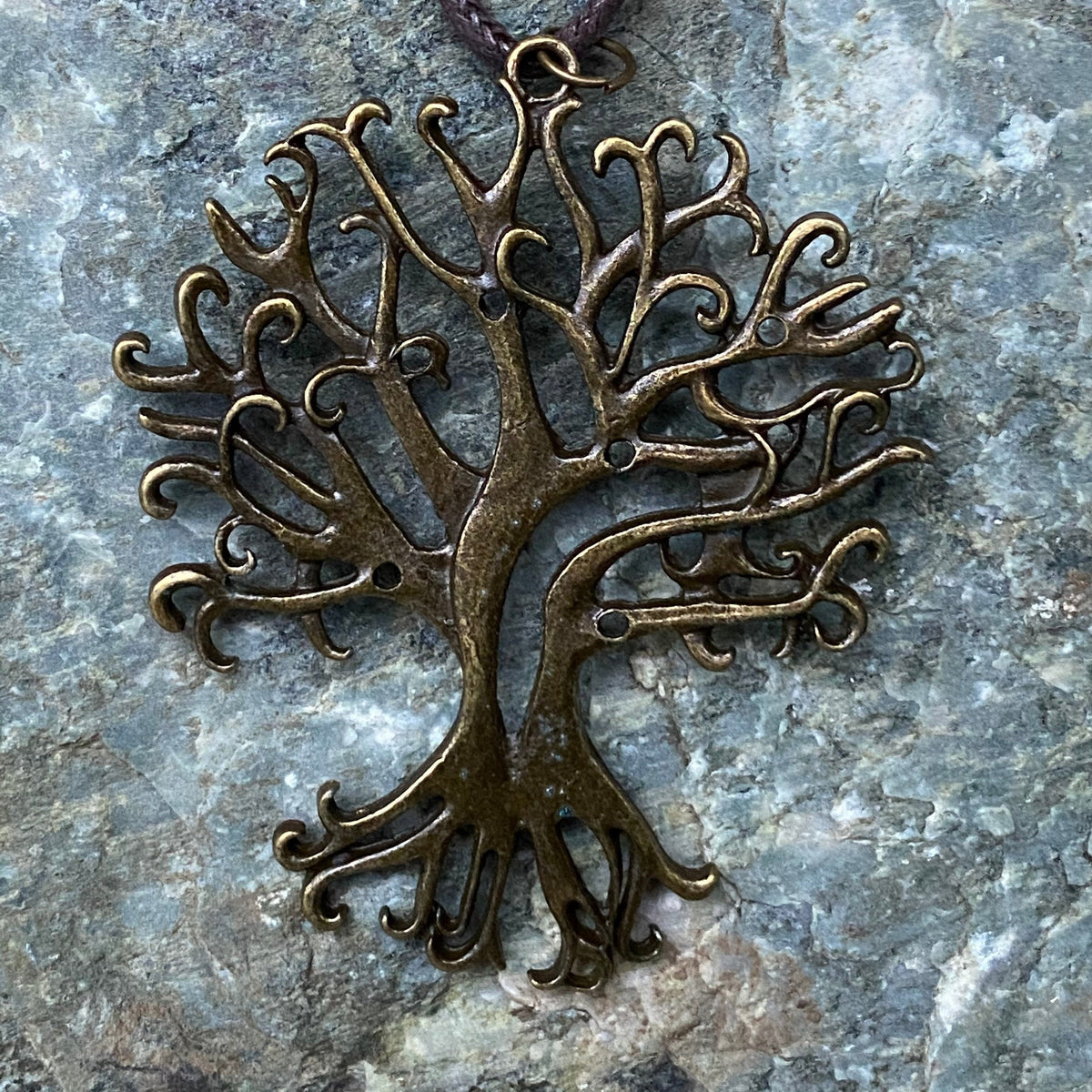 Brass tree amulet on stone, intricate branches for LARP medieval cosplay.