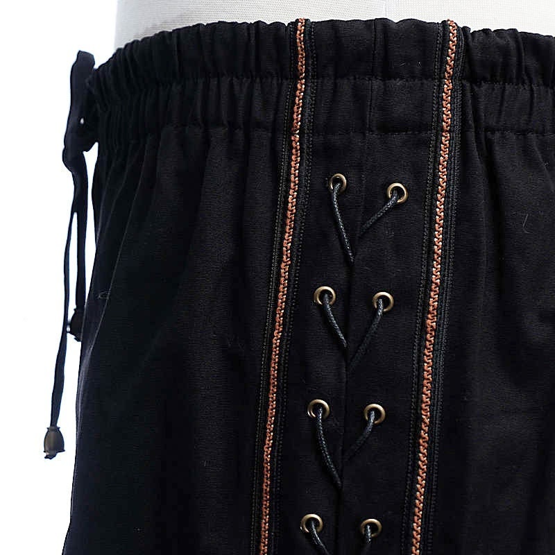 Black Viking trousers with side lace braiding for LARP close-up.