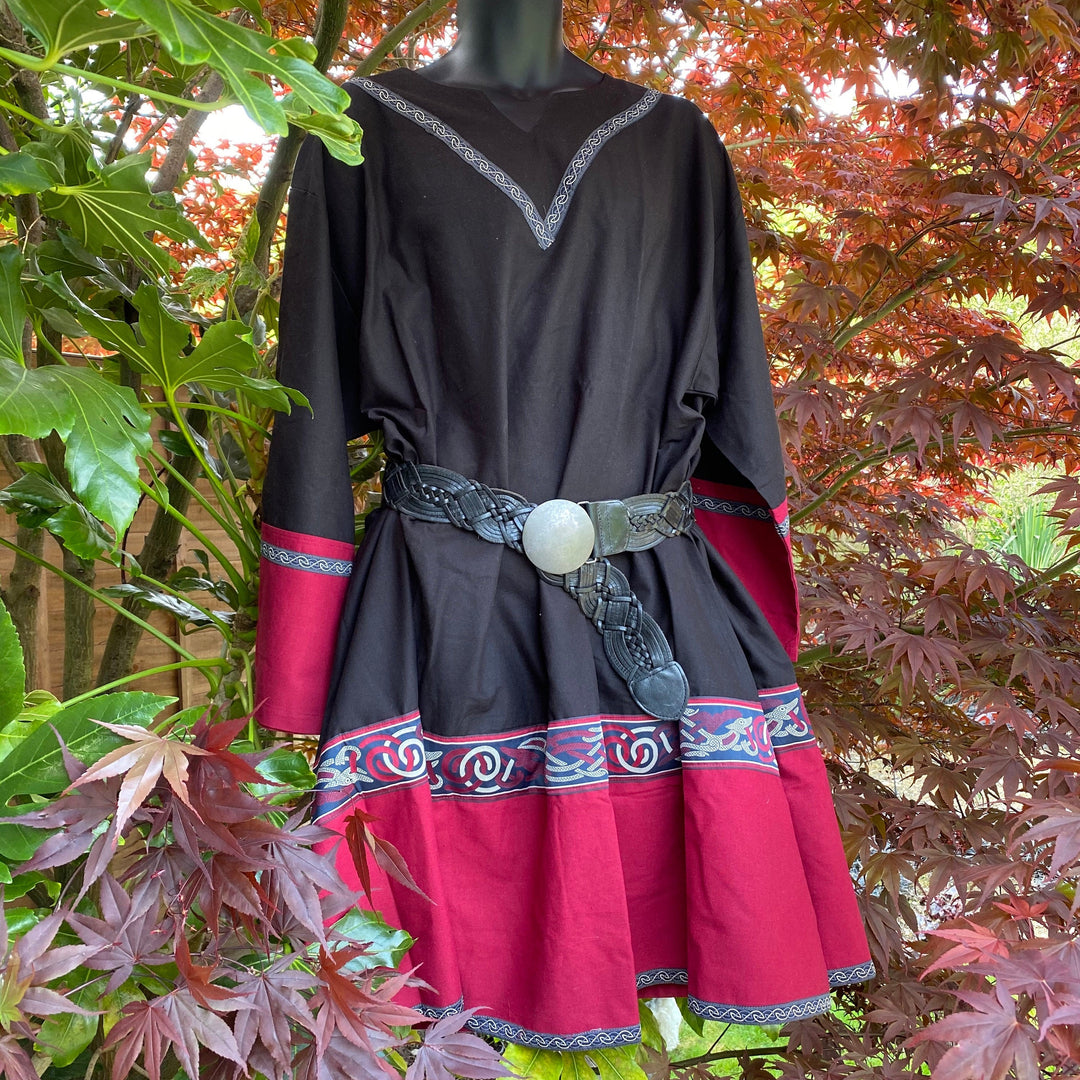 Black and red LARP tunic with intricate trim, styled with a leather belt.