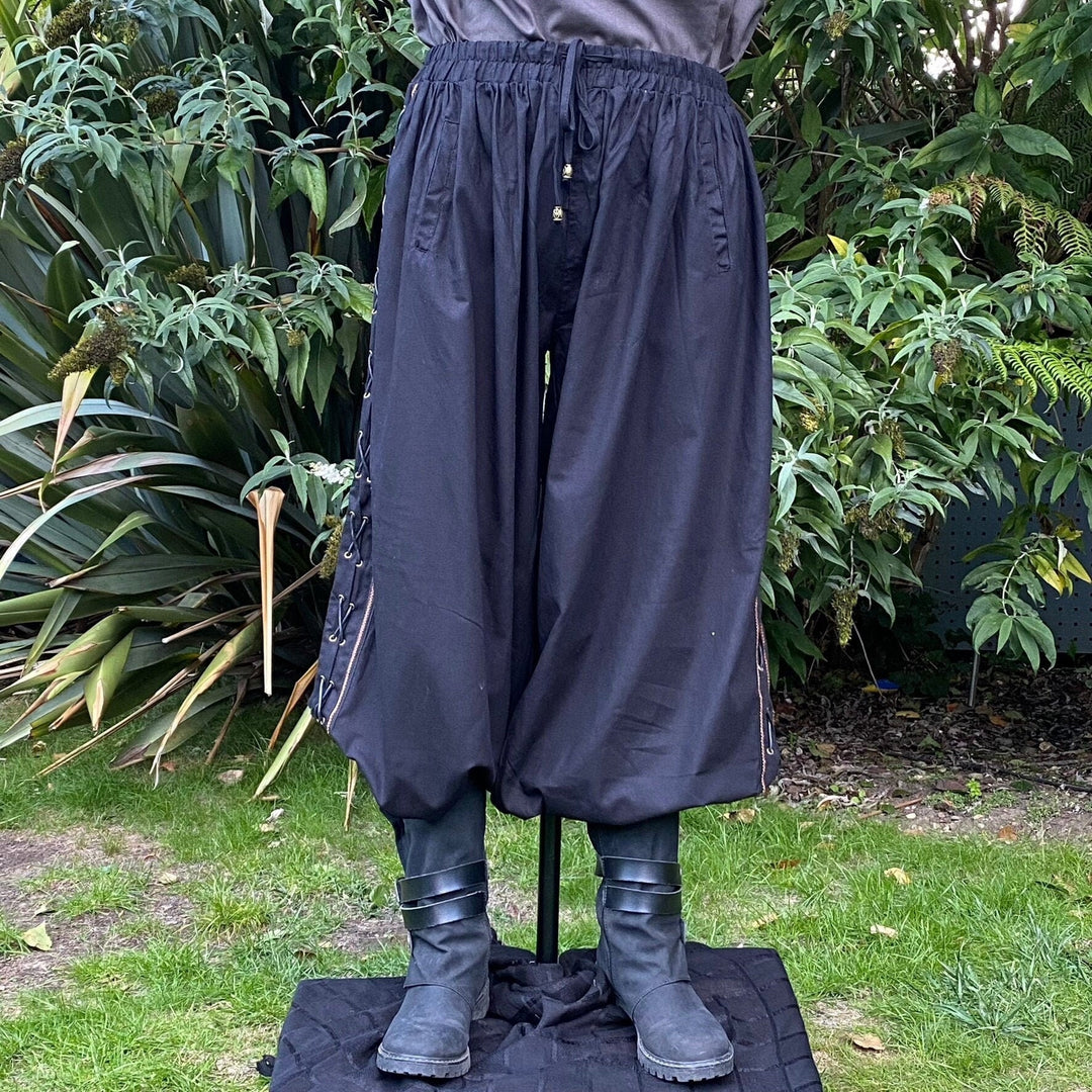Black cotton LARP hero pants with side lace and braiding, position 1 view.