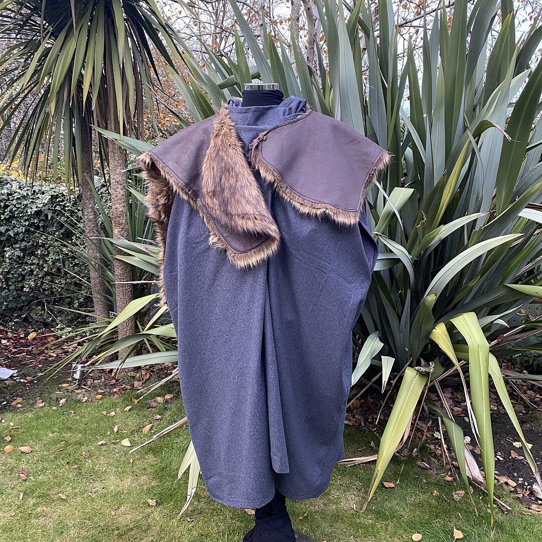 Viking LARP cloak on display, grey wool with faux fur trim.