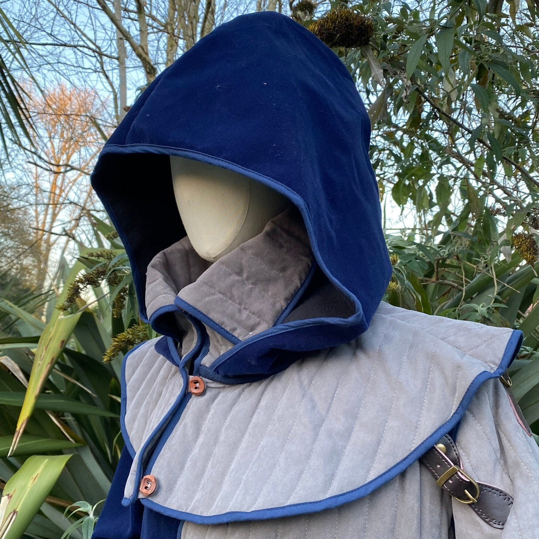 Azure LARP attire featuring grey gambeson and matching hood.