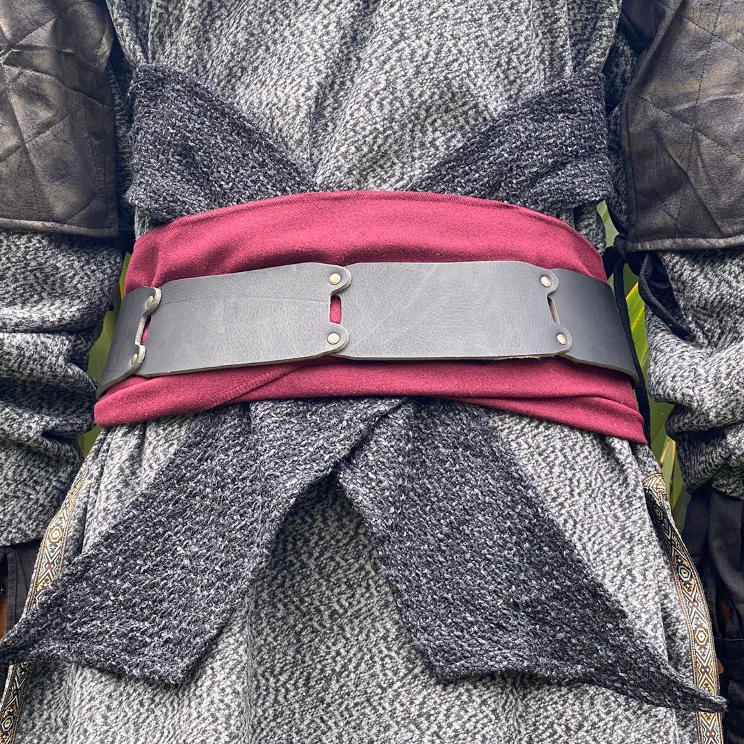 LARP costume belt on red and grey fabric, front view detailing.