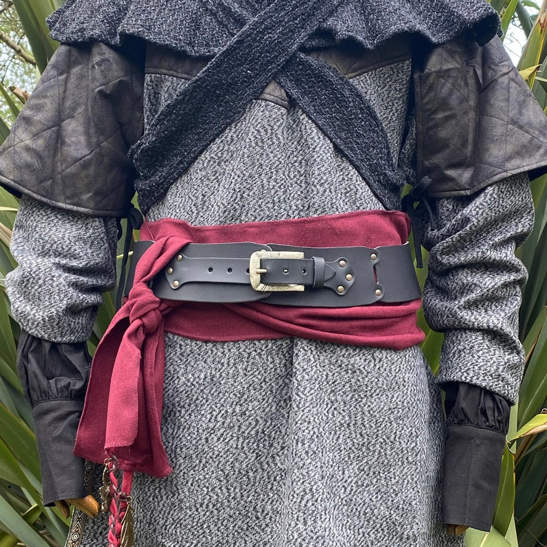 Black LARP belt in front view with burgundy sash on medieval costume.