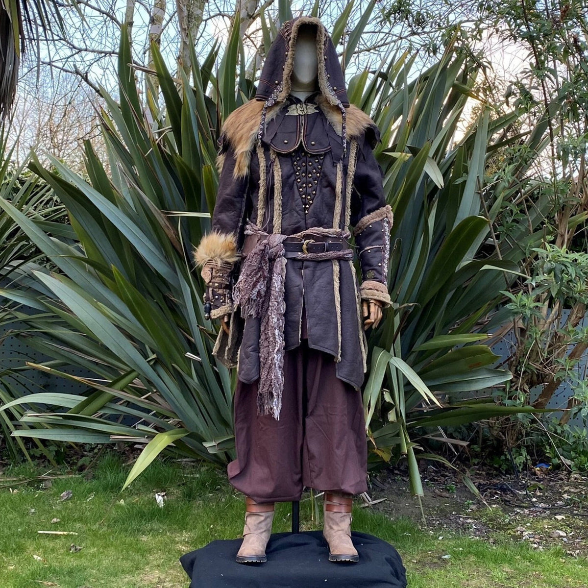 Hooded brown Viking LARP coat with fur trim and metal studs front view.