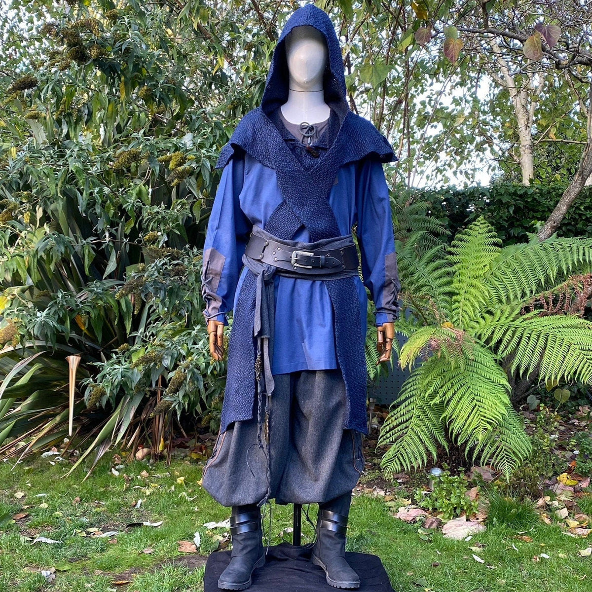 Medieval LARP outfit with blue hooded top, styled.