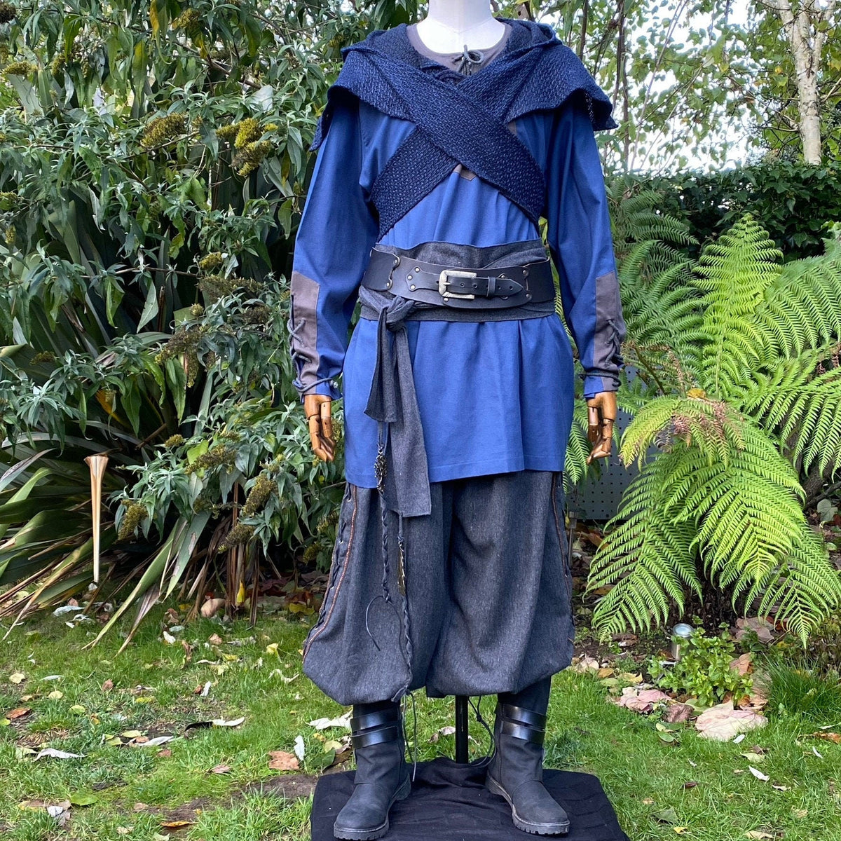 Blue tunic and grey pants LARP outfit with crossbody style hood.