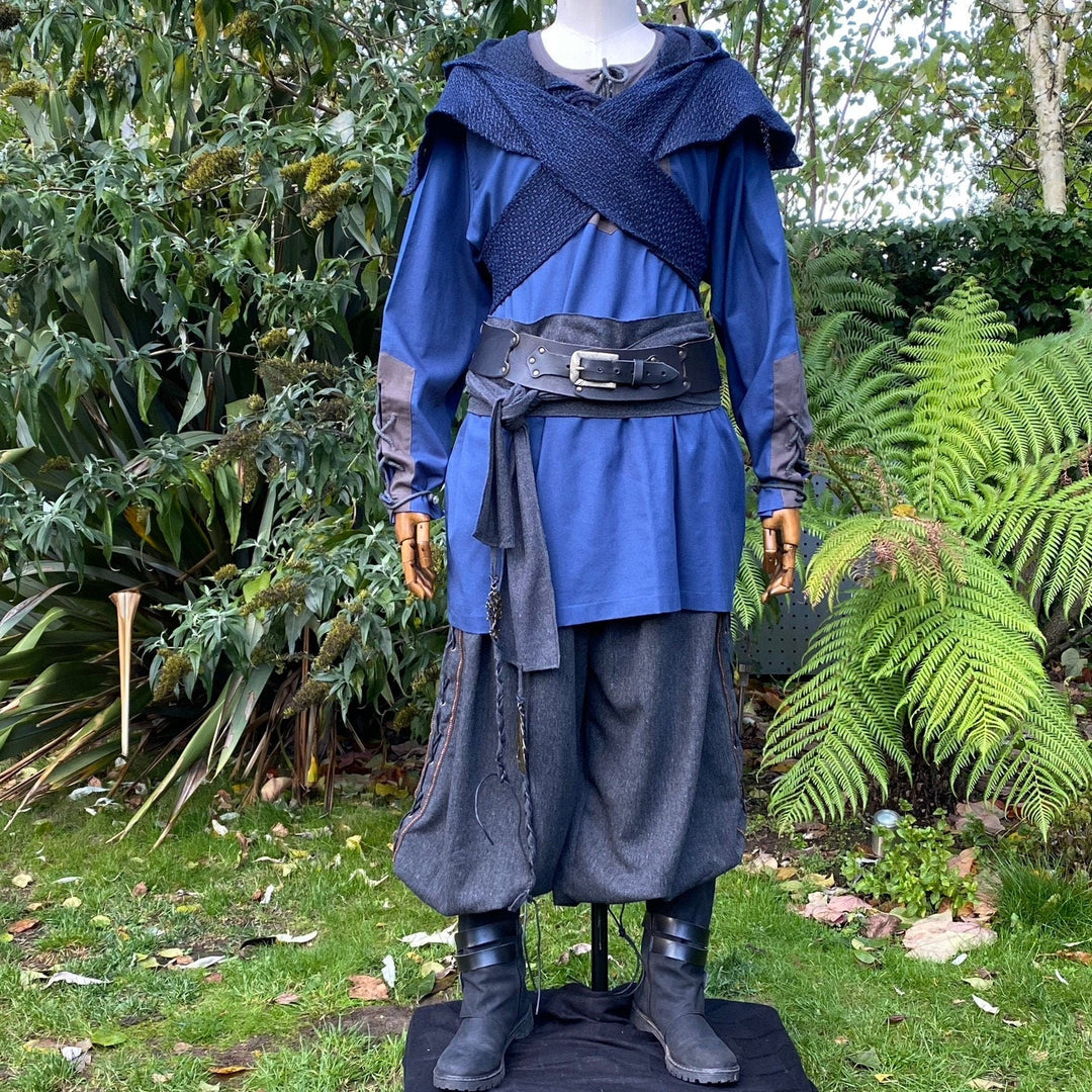 Blue tunic and grey pants LARP outfit with crossbody style hood.