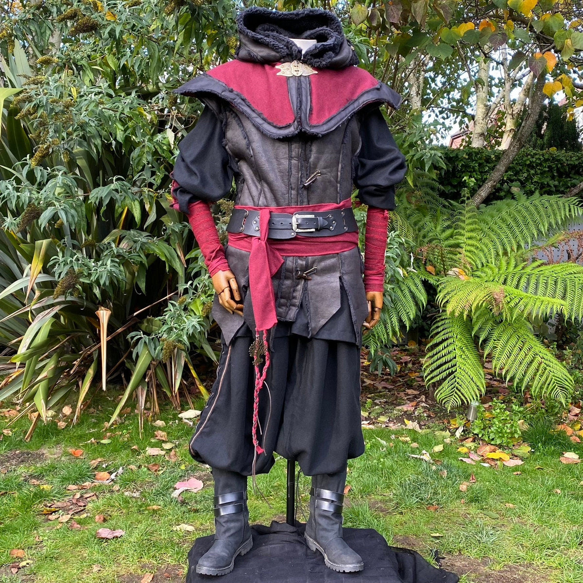 Red Hunter LARP set featuring a hood, waistcoat, shirt, belt, and sash.