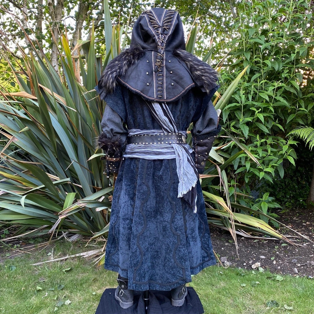Medieval LARP costume back view featuring waistcoat, shirt, hood, vambraces, trousers, and.