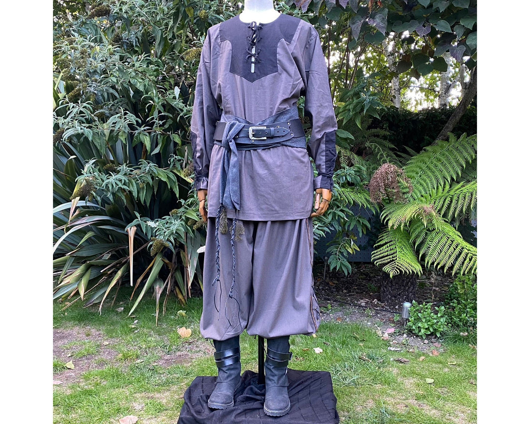 Medieval LARP outfit with grey tunic, pants, and sash.