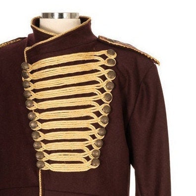 Close-up of gold-toned buttons and braiding detail on dark red LARP pirate coat.