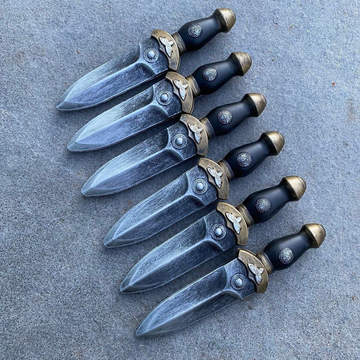 Set of foam daggers, gunmetal blades, ornate handles for LARP or medieval events.