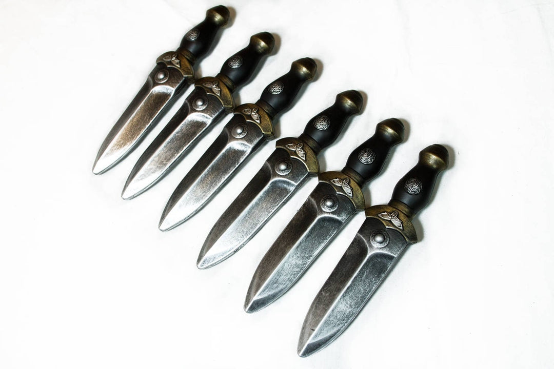 Medieval LARP daggers, pewter finish, side angle view, set of six aligned.