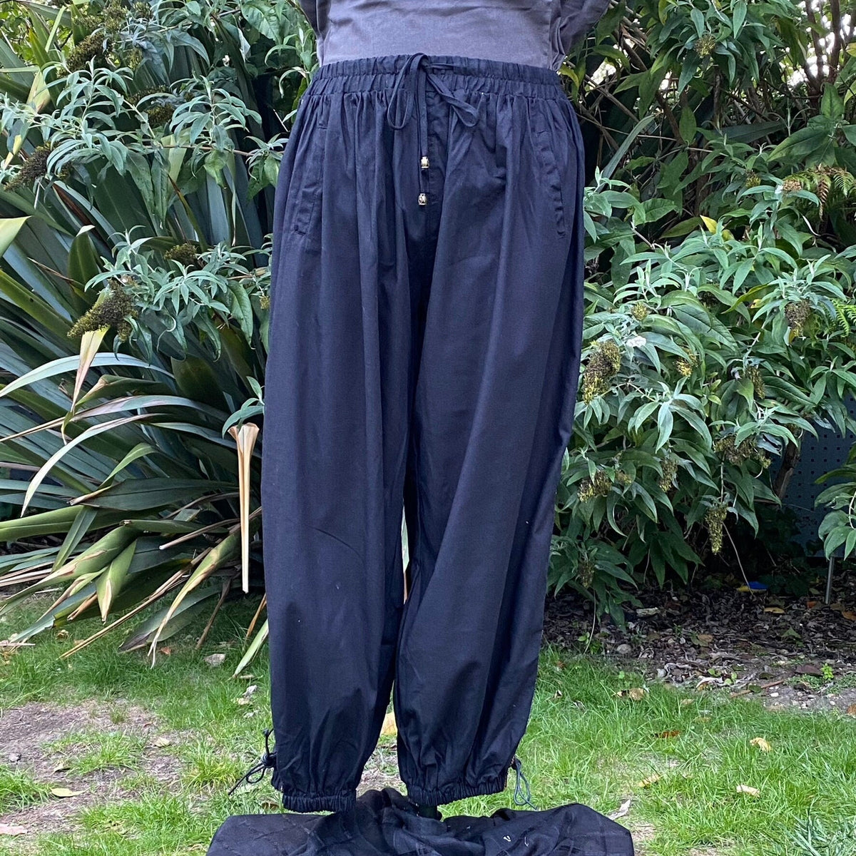Loose black medieval LARP trousers with drawstring waist.