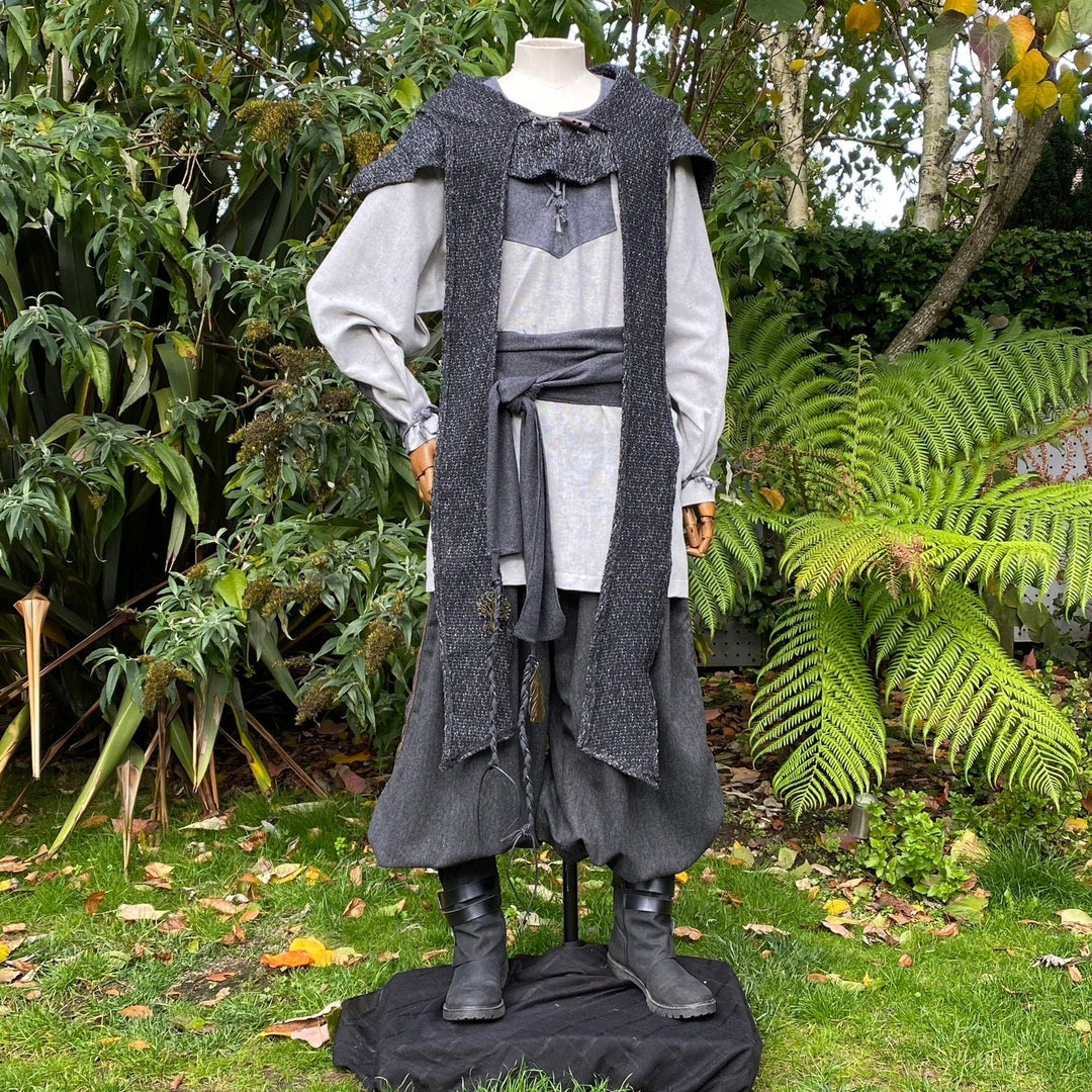Medieval LARP outfit on mannequin, front view, garden background, grey tones.