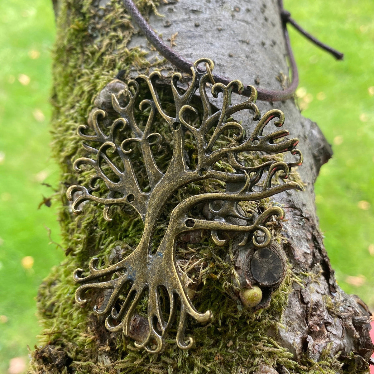 Tree charm necklace on mossy branch, detailed brass, LARP medieval theme.