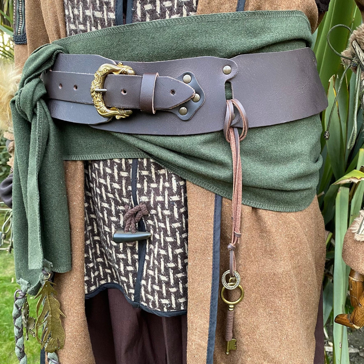 Buffalo leather LARP belt with ornate buckle and key, side view.