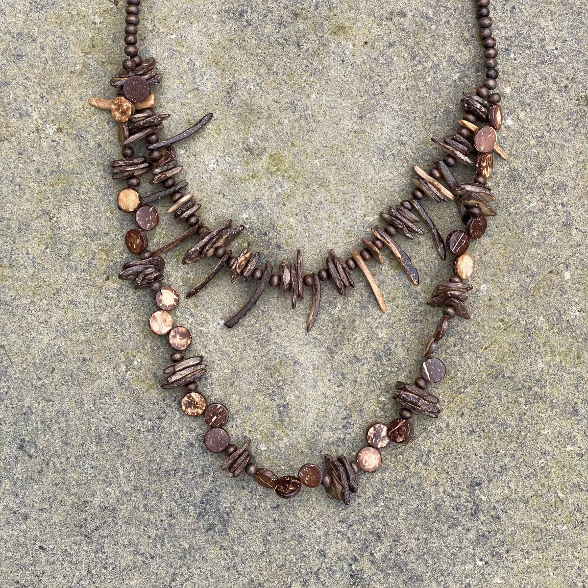 Dual-layered tooth necklace on stone for LARP.