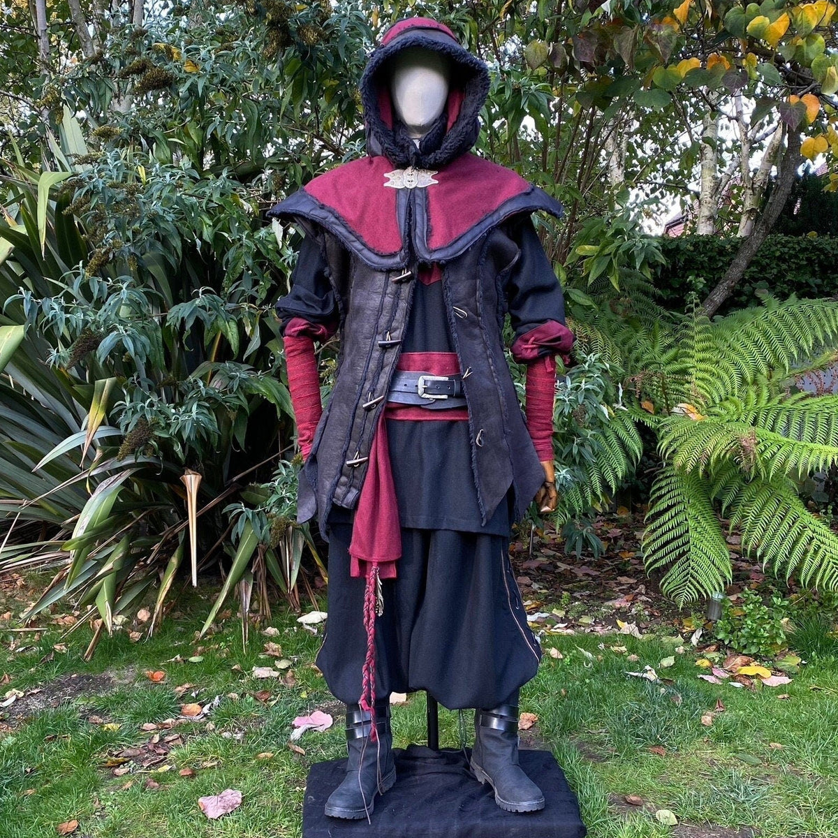 Medieval LARP outfit front view, featuring a red and black hood, waistcoat, shirt, belt and sash.