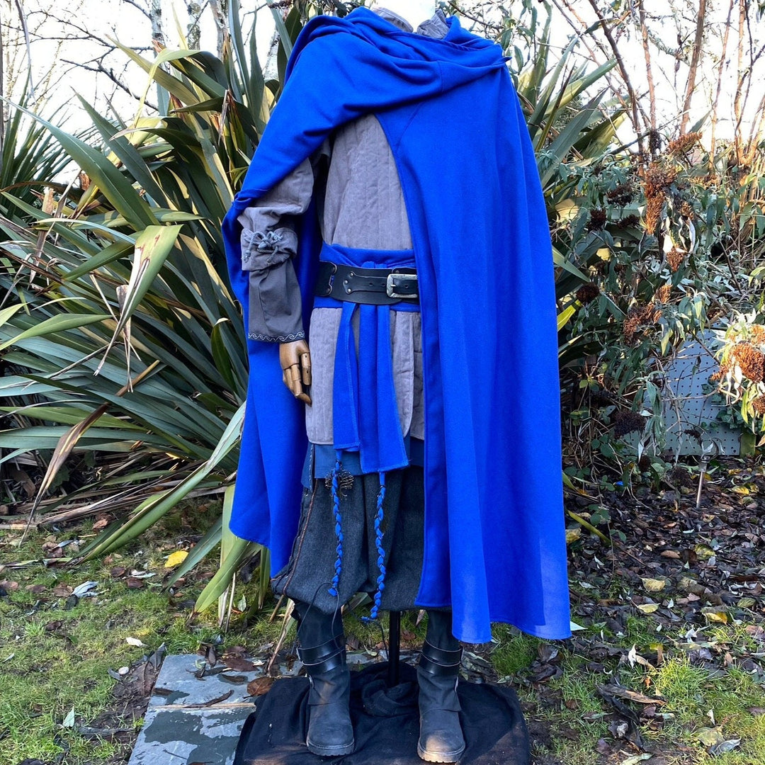Mannequin in medieval LARP wear with blue cloak and grey gambeson.