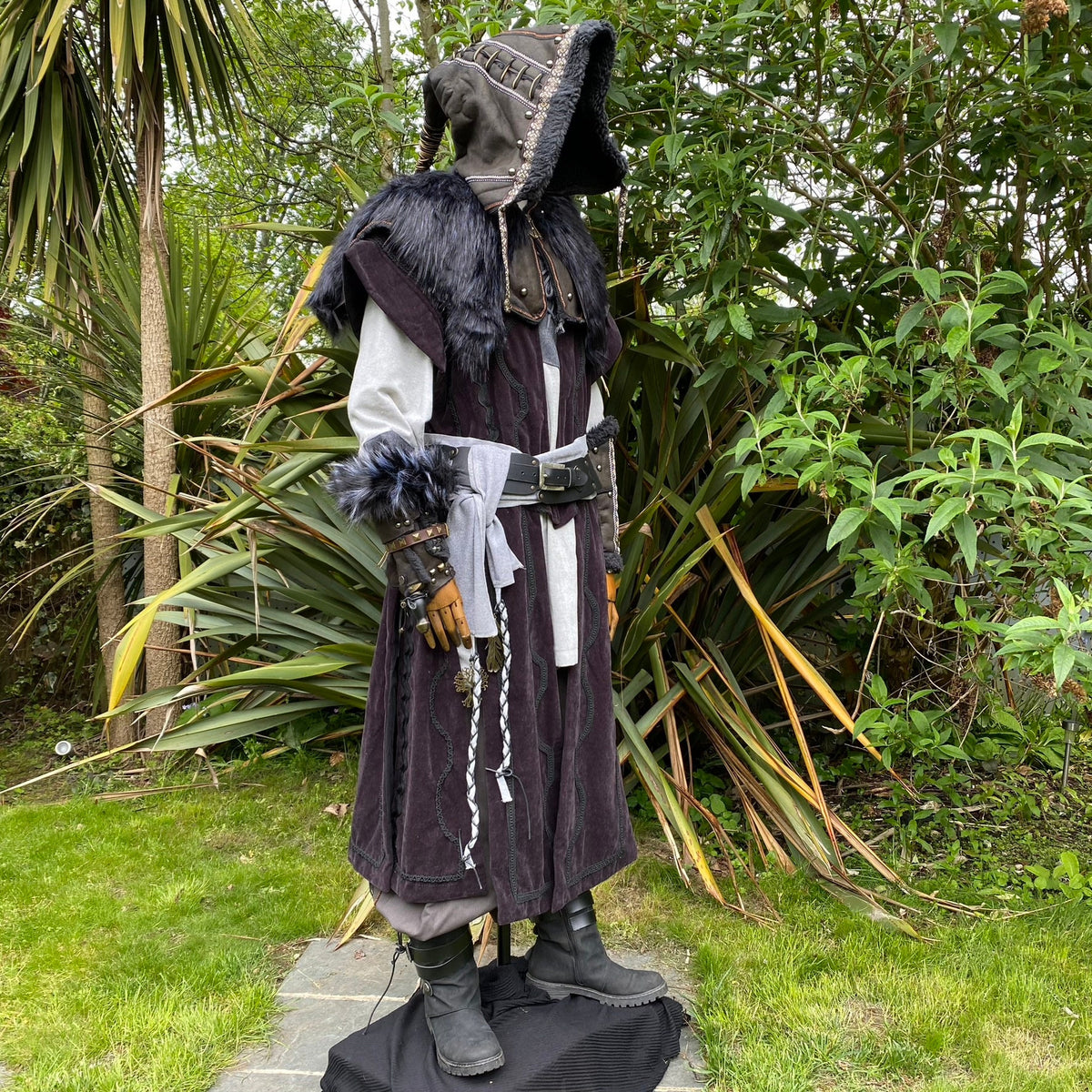 LARP hooded outfit side view with tunic, vambraces, and fur details.