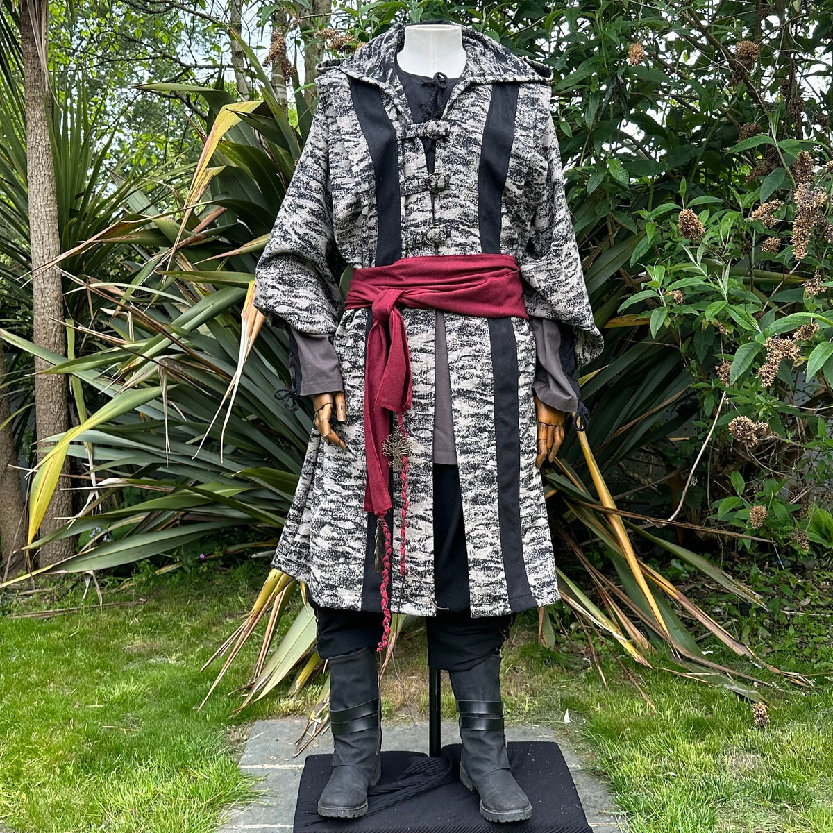 LARP battle mage set with a striped robe, grey and black, red sash, front view.