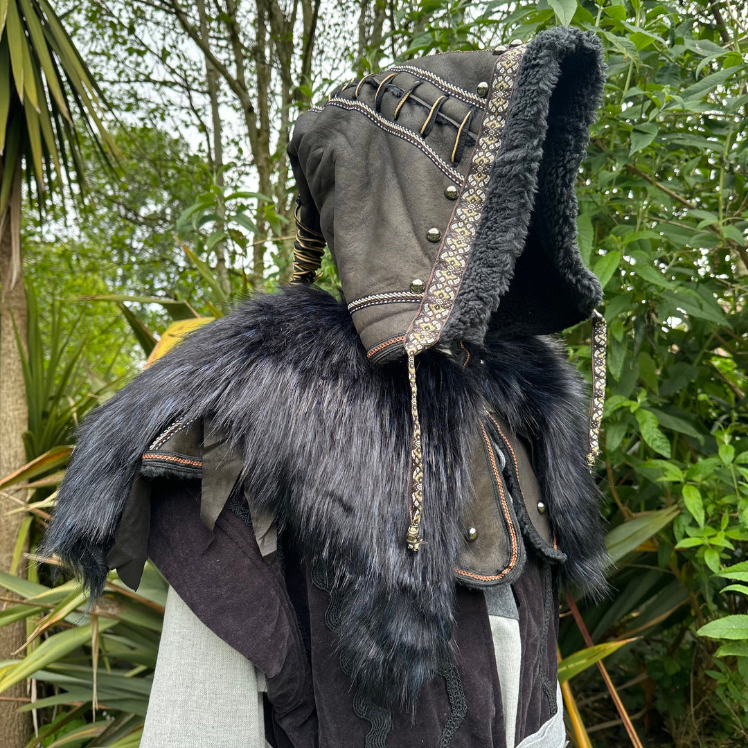 Side view of black LARP hood with intricate trim and faux fur detailing.