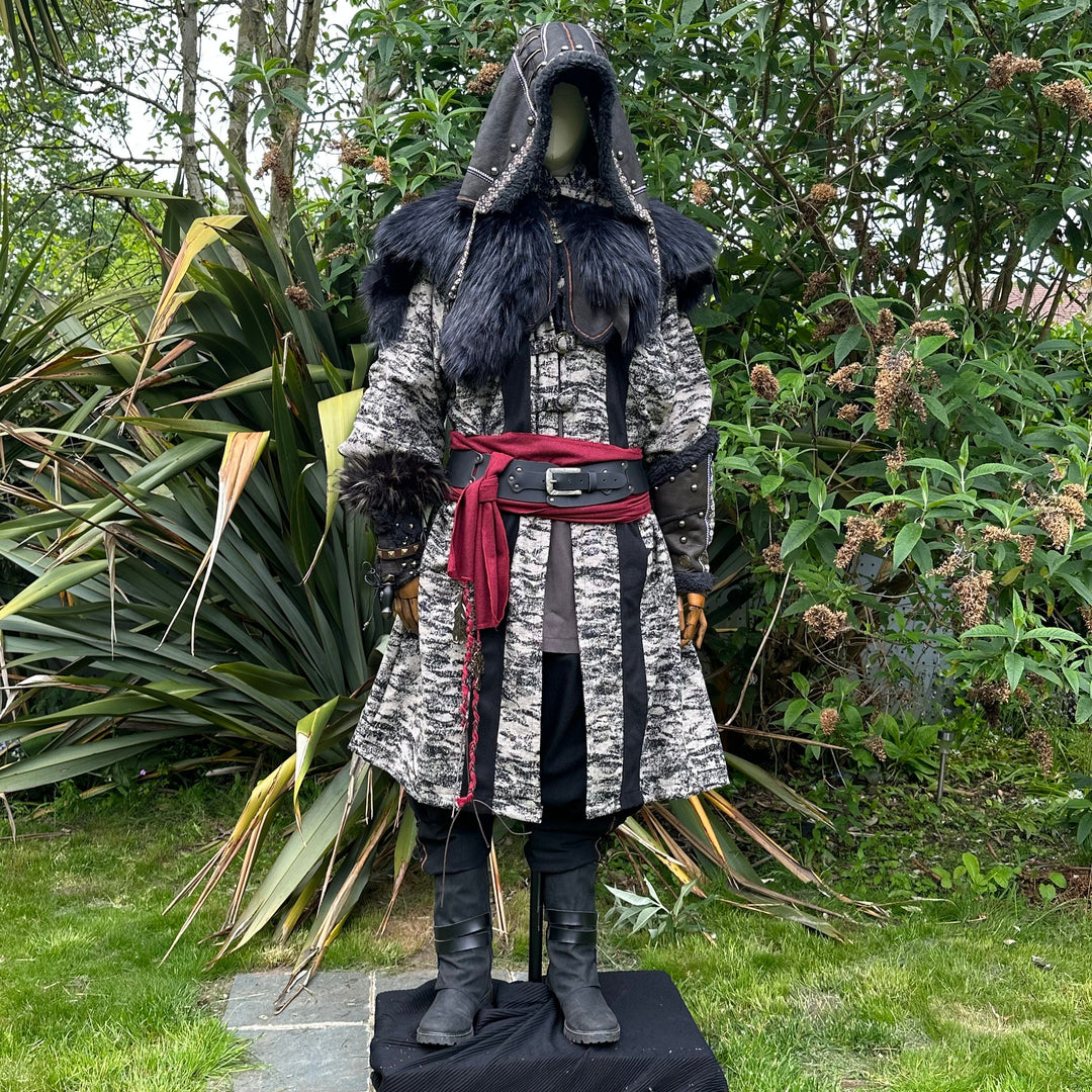 Medieval LARP costume front view, featuring faux leather hood and vambraces, brown hooded robe.