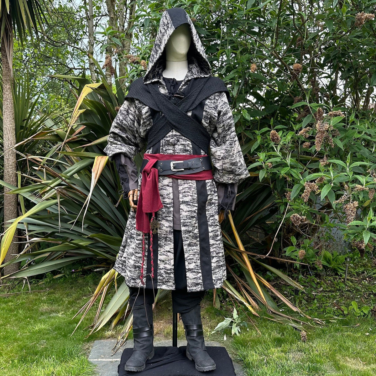 Medieval LARP costume front view, featuring brown and black hooded robe, wool hood, shirt.