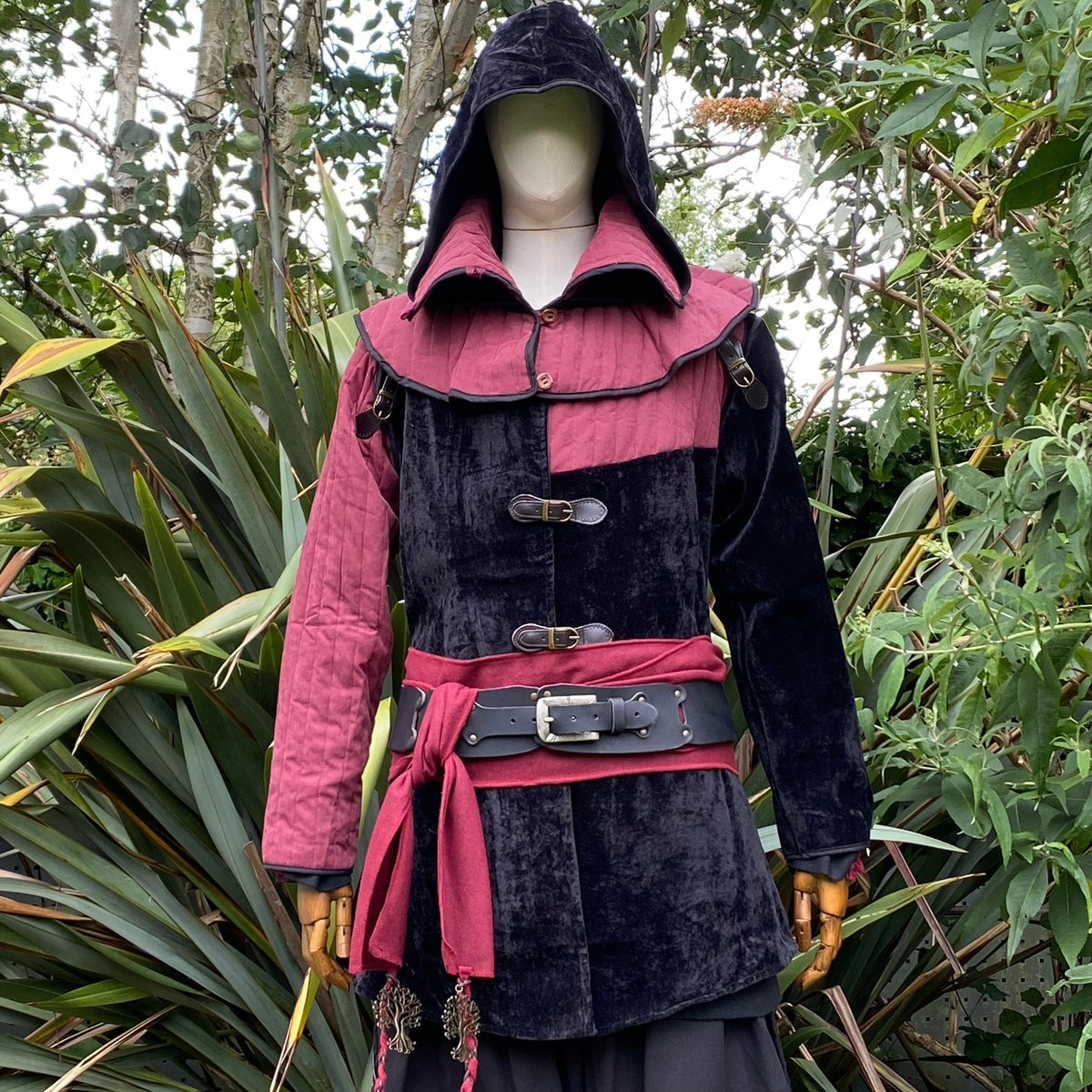 Medieval LARP costume with hooded jacket and belt.