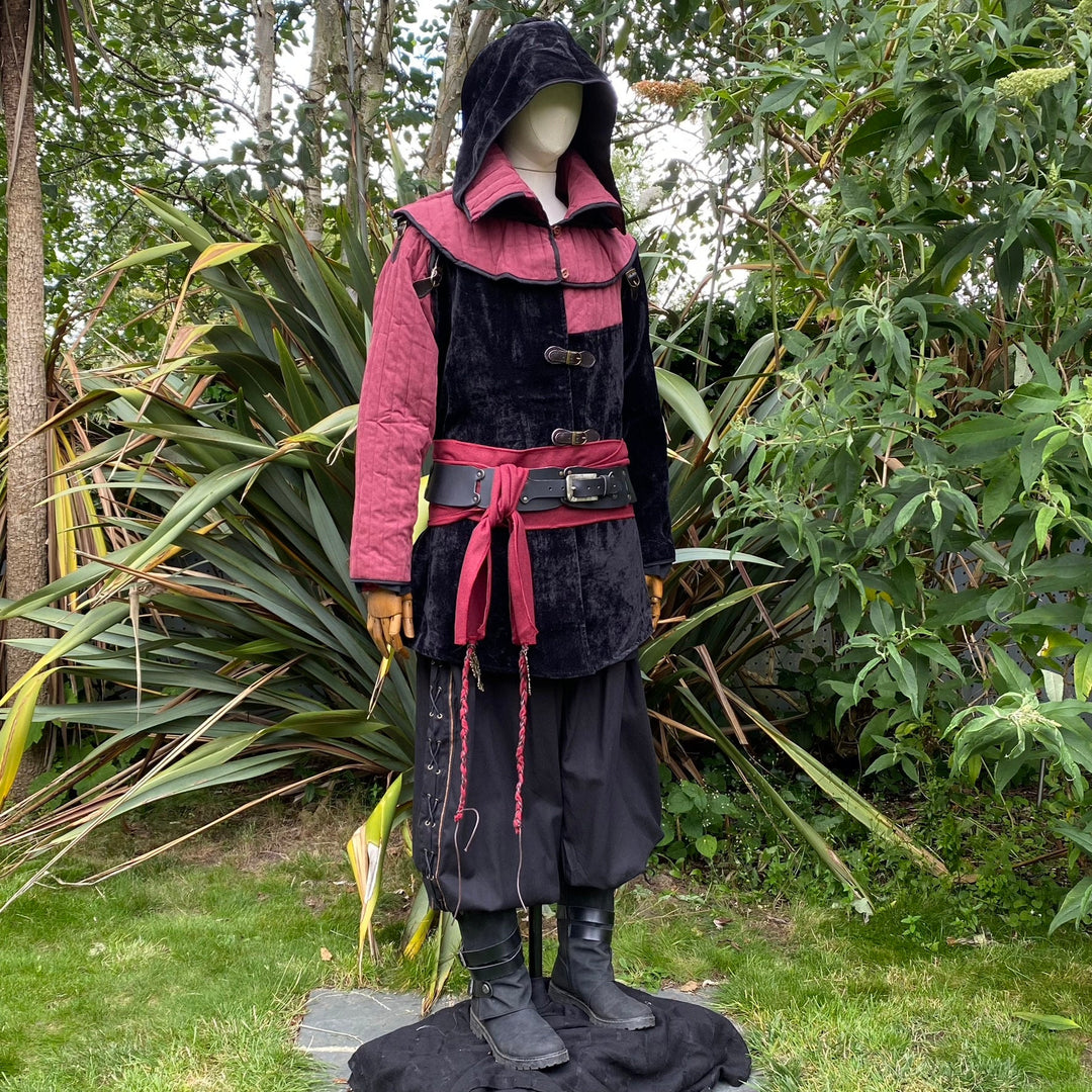 Side view of a medieval LARP costume, featuring a black and red gambeson jacket with removable.