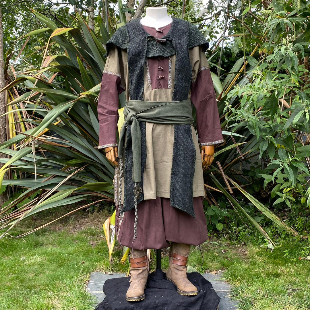 Medieval LARP outfit with green sash, hood, and brown tunic.