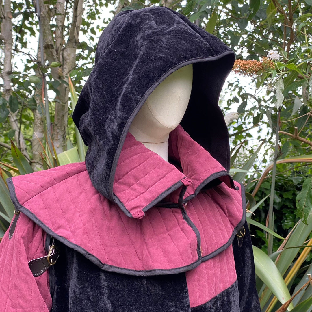 Black snood hood with quilted pink mantle for medieval LARP, side.