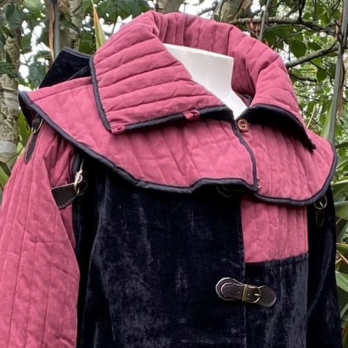 LARP mantle with quilted detail, red and black suede, medieval style in nature.