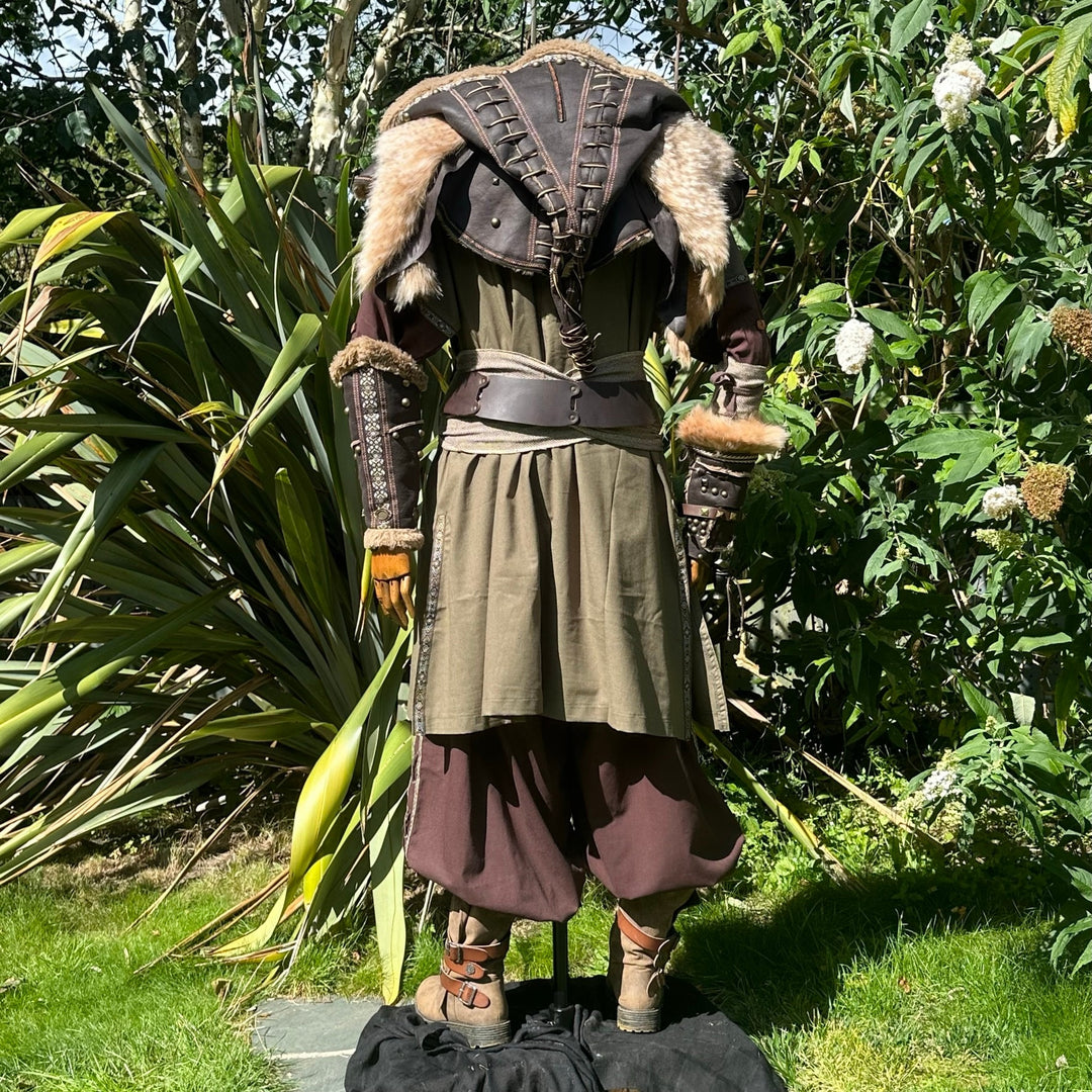Back view of medieval LARP outfit with fur details and leather accents.